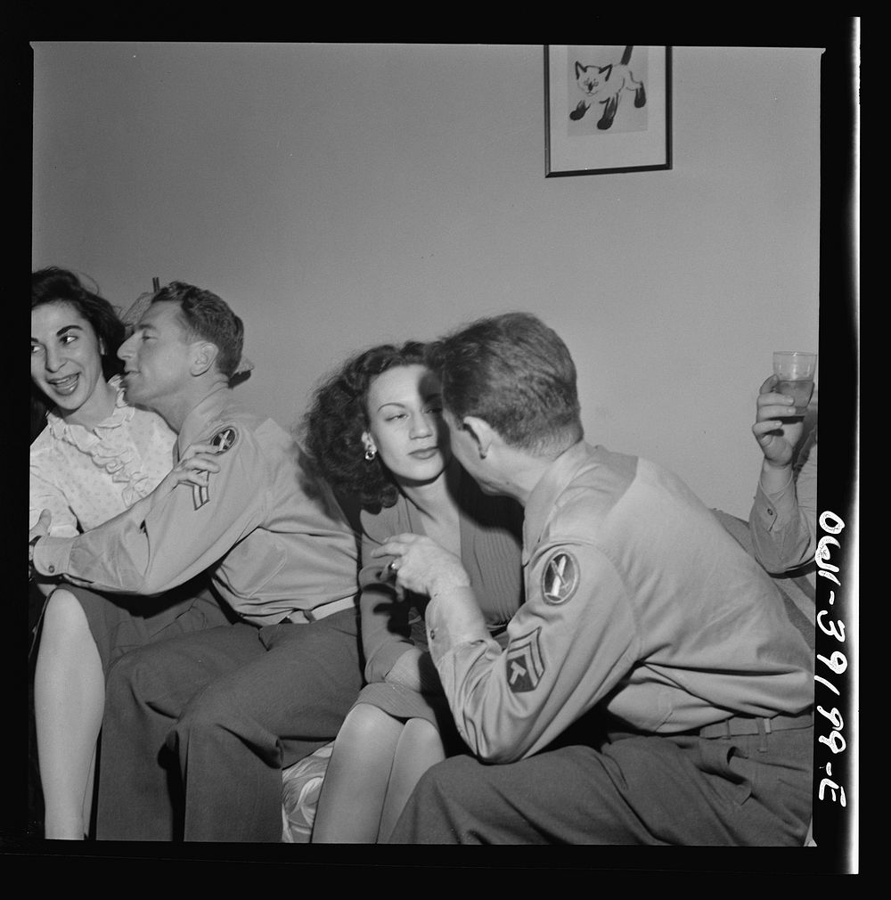 Two corporals and their girls at a party. Washington, D.C.. Sourced from the Library of Congress.