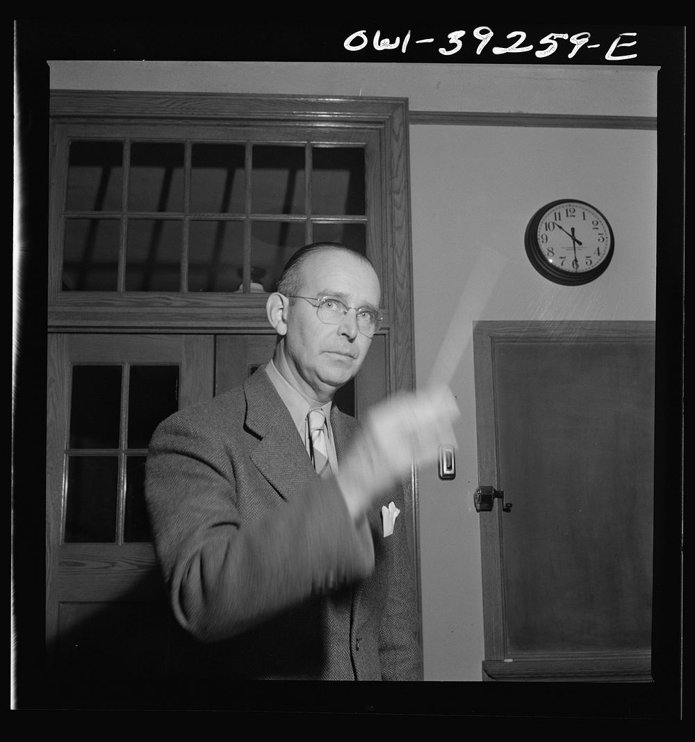 [Untitled photo, possibly related to: Washington, D.C. Director of the school orchestra at Woodrow Wilson High School].…