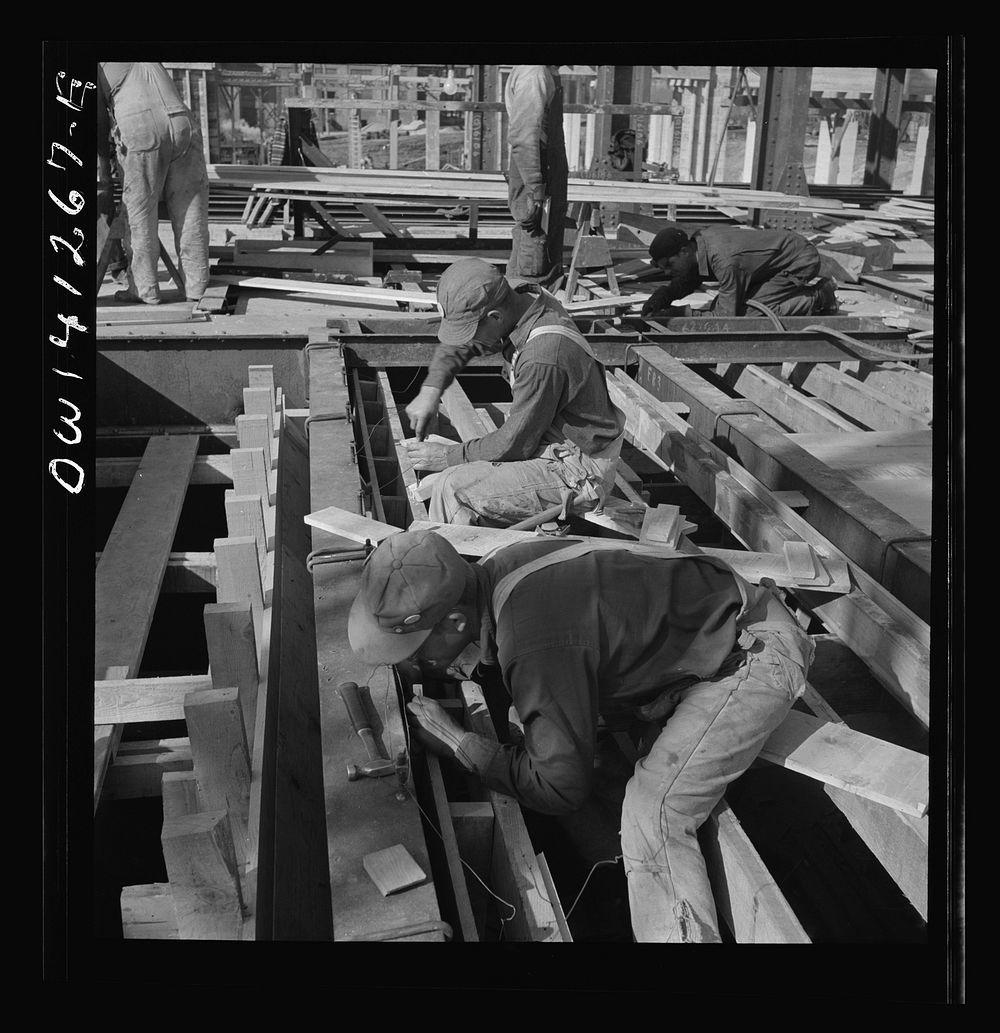 Bingham Canyon, Utah. Building a trestle bridge at the open-pit mine of the Utah Copper Company. Sourced from the Library of…