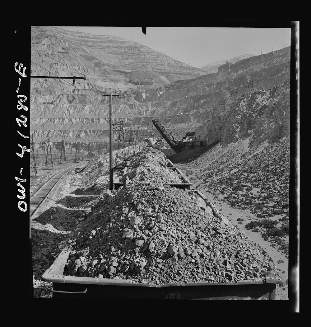 [Untitled photo, possibly related to: Bingham Canyon, Utah. Looking over the tops of cars loaded with ore at an open-pit…