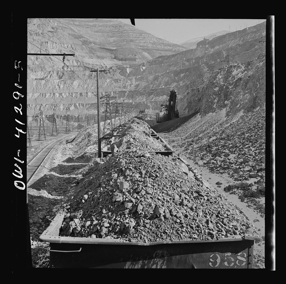 [Untitled photo, possibly related to: Bingham Canyon, Utah. Looking over the tops of cars loaded with ore at an open-pit…