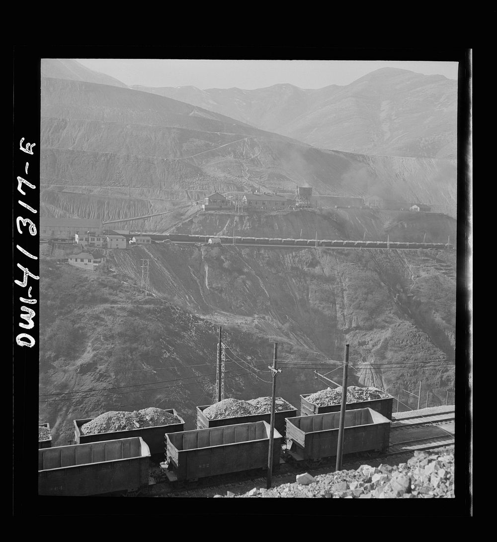 [Untitled photo, possibly related to: Bingham Canyon, Utah. Open-pit workings on the Utah Copper Company showing cars loaded…