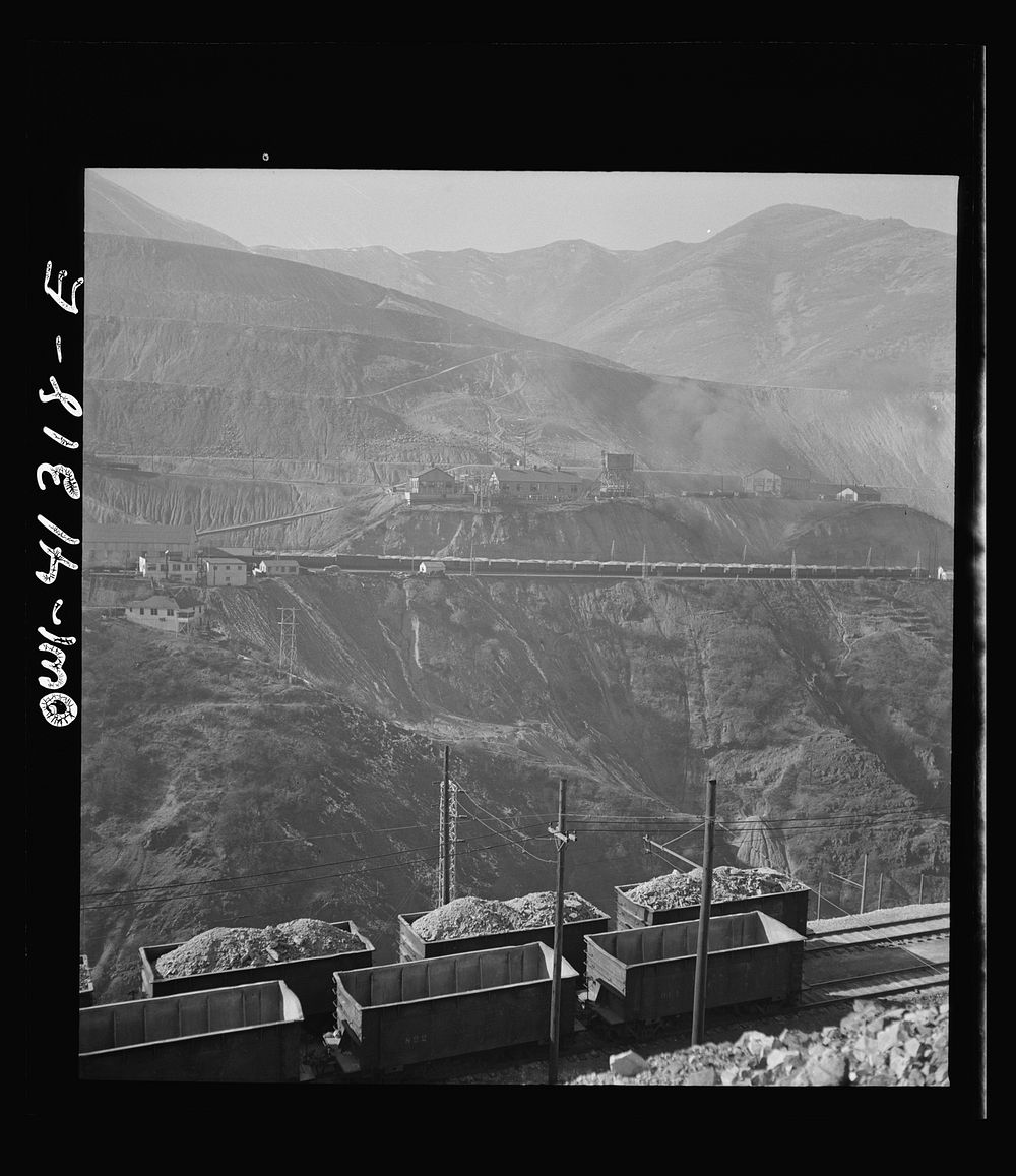 Bingham Canyon, Utah. Open-pit workings on the Utah Copper Company showing cars loaded with ore. Sourced from the Library of…