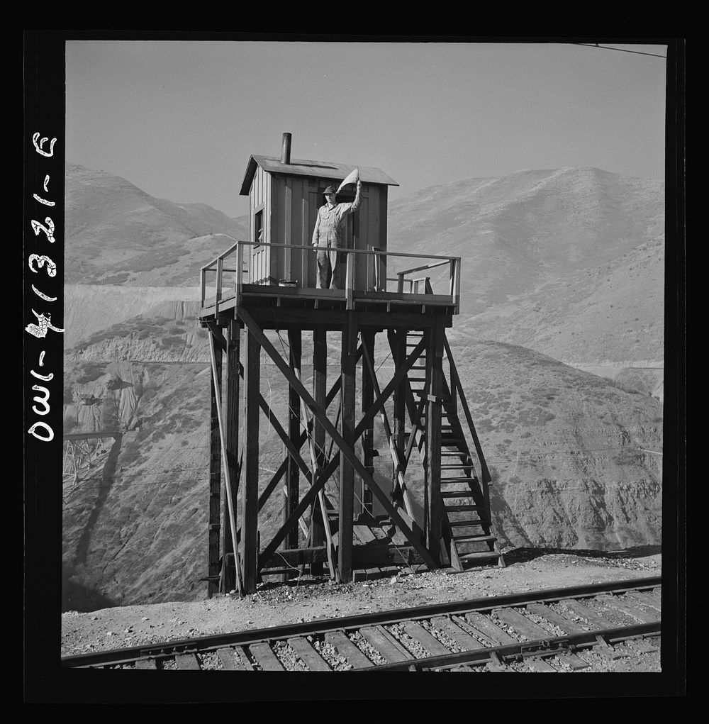 [Untitled photo, possibly related to: Bingham Canyon, Utah. Signalman of the Utah Copper Company at its open-pit mine…