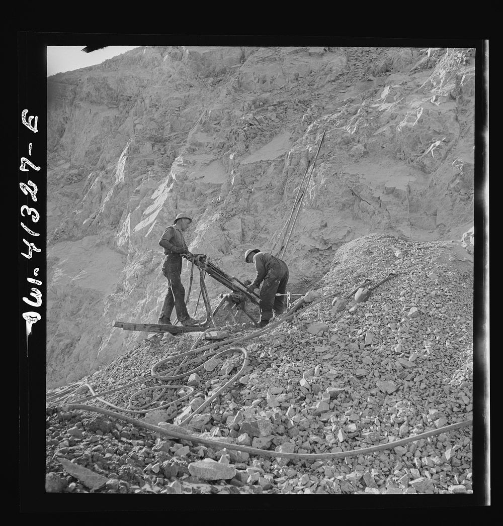 Bingham Canyon, Utah. Drilling blast holes with a rock-drill machine in an open-pit mine operated by the Utah Copper…