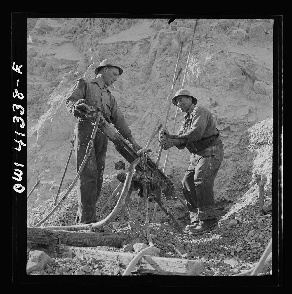 [Untitled photo, possibly related to: Bingham Canyon, Utah. Drilling blast holes with a rock-drill machine in an open-pit…