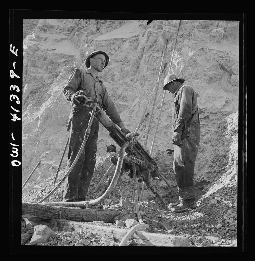 [Untitled photo, possibly related to: Bingham Canyon, Utah. Drilling blast holes with a rock-drill machine in an open-pit…