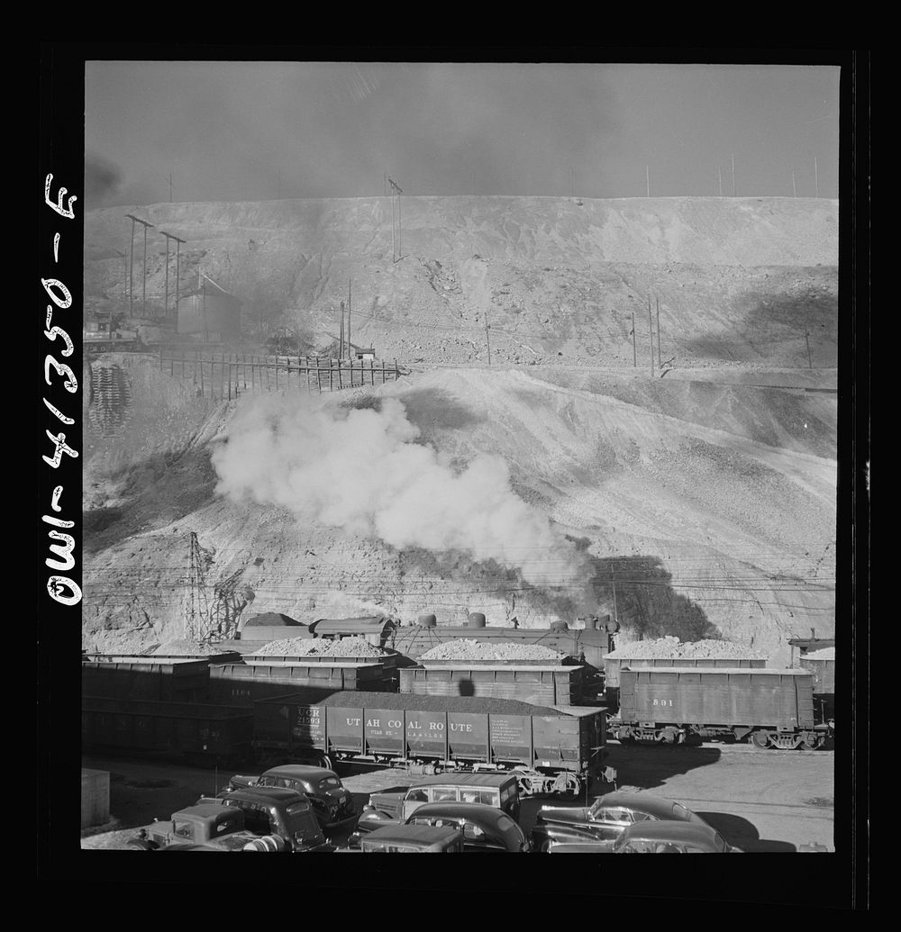 Bingham Canyon, Utah. Ore trains in a trestle bridge above an open pit mine of the Utah Copper Company. Sourced from the…