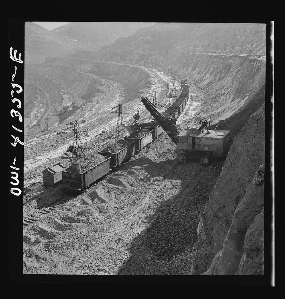 [Untitled photo, possibly related to: Bingham Canyon, Utah. Loading ore into car with a power shovel at an open-pit mine of…