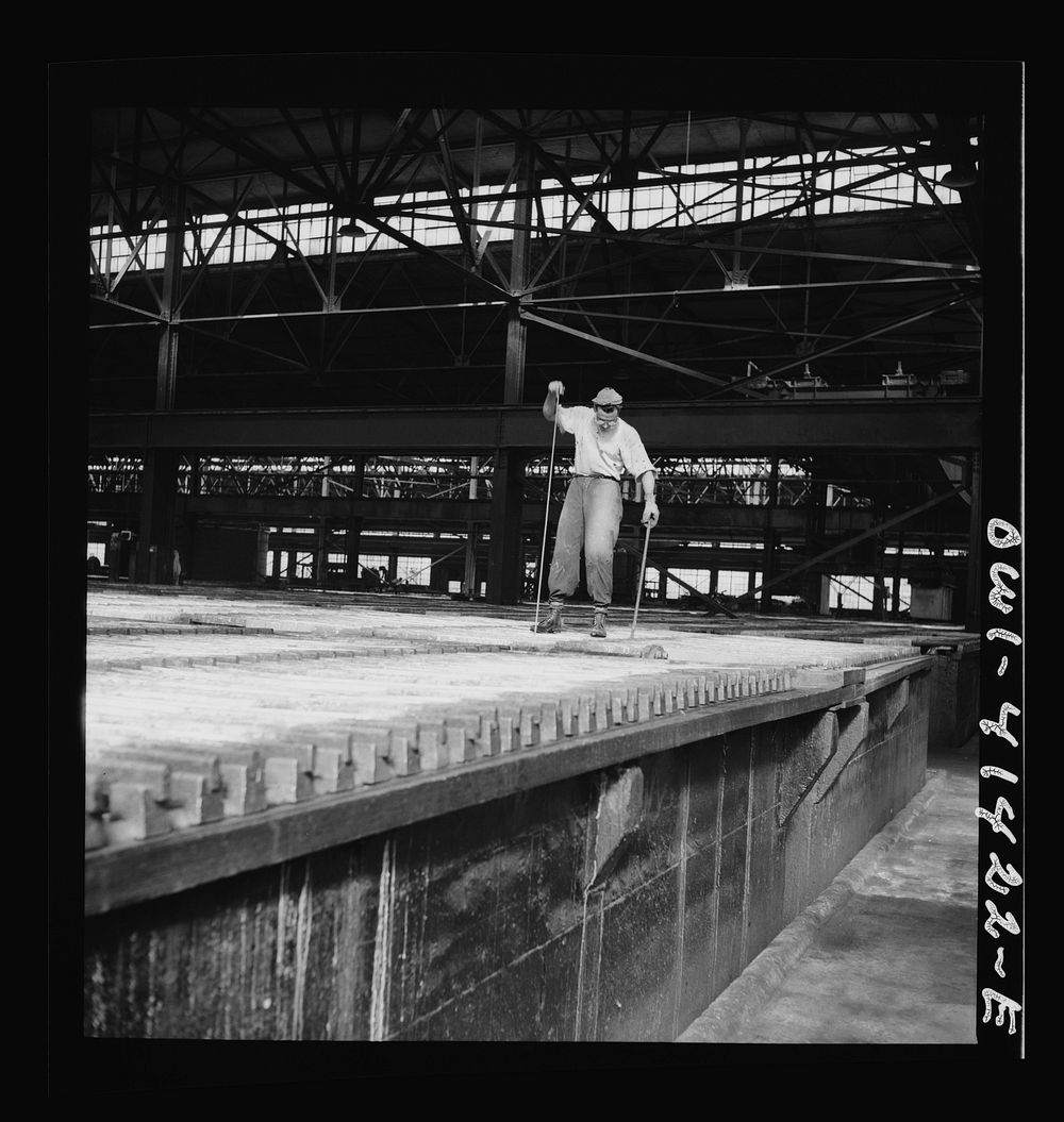 [Untitled photo, possibly related to: El Paso, Texas. Phelps Dodge refinng company. Working at the electrolytic tanks in…