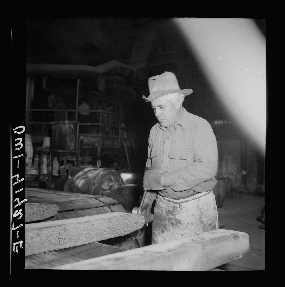El Paso, Texas. Workman trimming an ingot at the Phelps Dodge refining plant. Sourced from the Library of Congress.