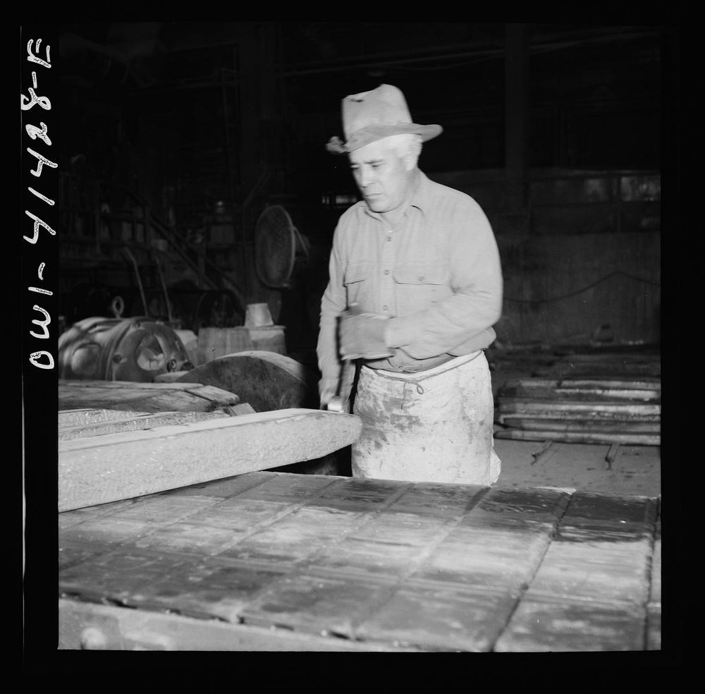 [Untitled photo, possibly related to: El Paso, Texas. Workman trimming an ingot at the Phelps Dodge refining plant]. Sourced…