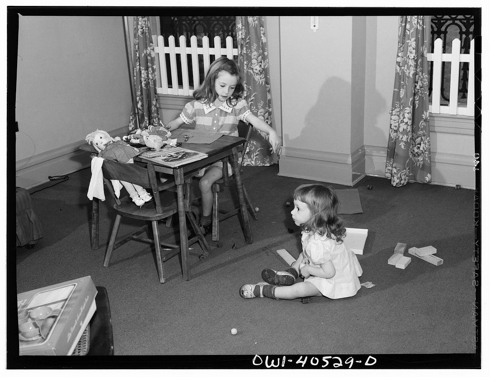 Washington, D.C. Children playing in the nursery at the United Nations service center while their mother makes arrangements…