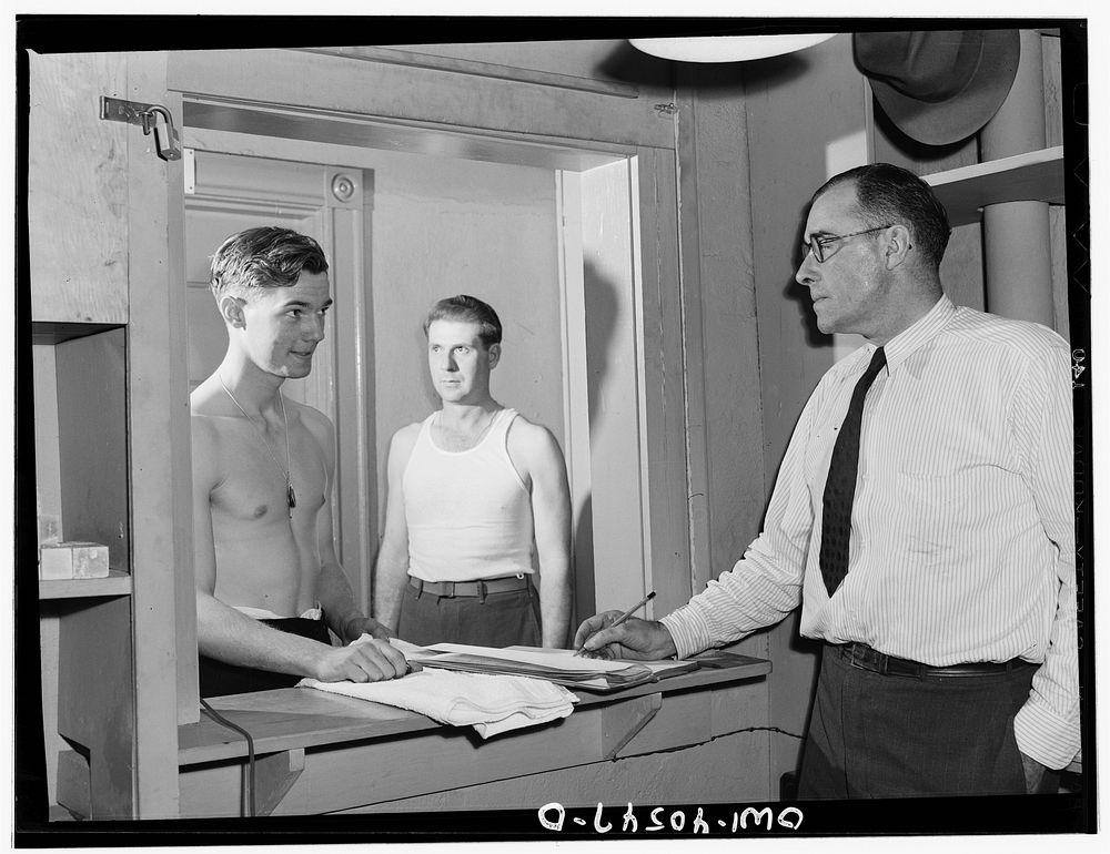 Washington, D.C. Servicemen getting towels and soap from an attendant in the enlisted men's shower room at the United…