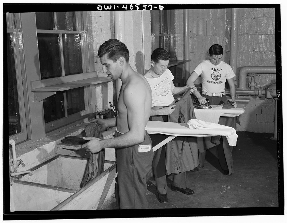 Washington, D.C. Servicemen using the laundry facilities in the sub-basement of the United Nations service center. It is not…