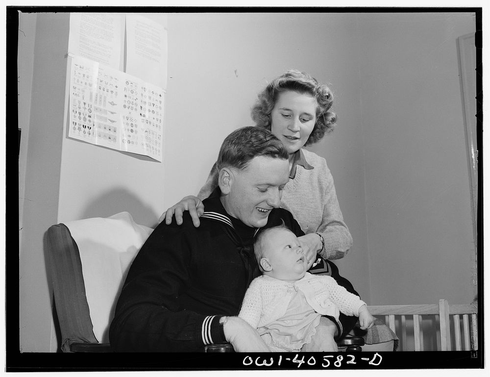 Washington, D.C. Hugh and Lynn Massman with their son Joey in the nursery at the United Nations service center. Sourced from…