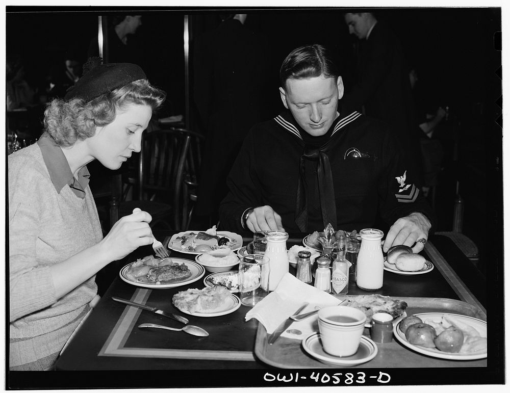 Washington, D.C. Hugh and Lynn Massman eating lunch at a cafeteria after a day of sightseeing. Their eight-weeks-old son is…