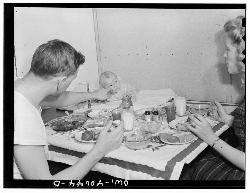 Washington, D.C. Hugh Massman, a second class petty officer who is studying in Washington, D.C. and his wife eating dinner.…