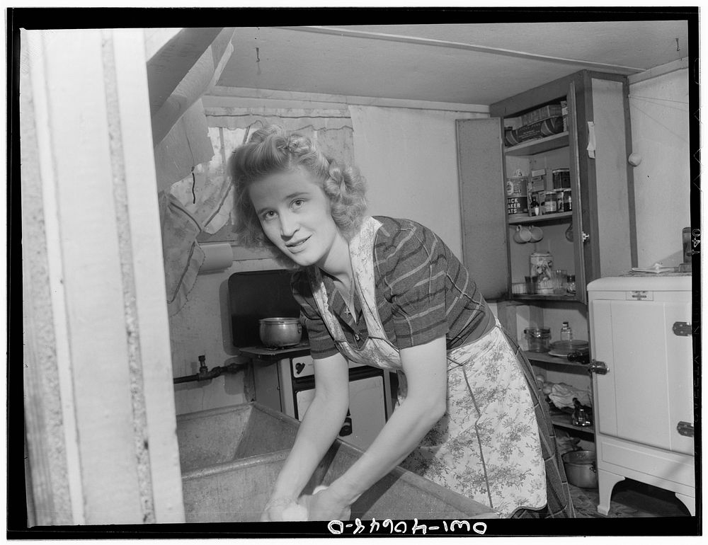 [Untitled photo, possibly related to: Washington, D.C. Lynn Massman, wife of a second class petty officer who is  studying…