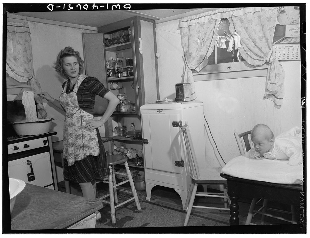 Washington, D.C. Lynn Massman, wife of a second class petty officer who is  studying in Washington, does the washing every…