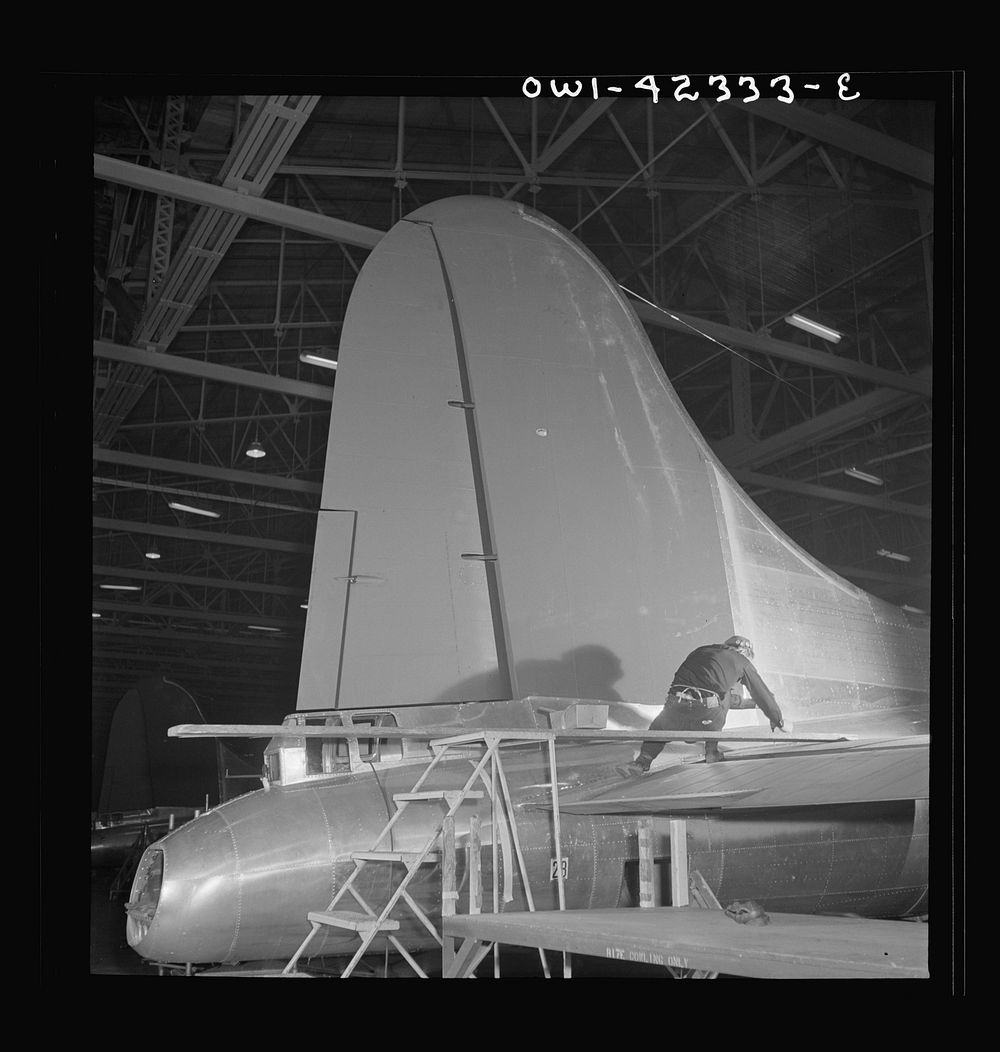 [Untitled photo, possibly related to: Production. B-17 heavy bomber. The tail and rudder of a mighty B-17F (Flying Fortress)…