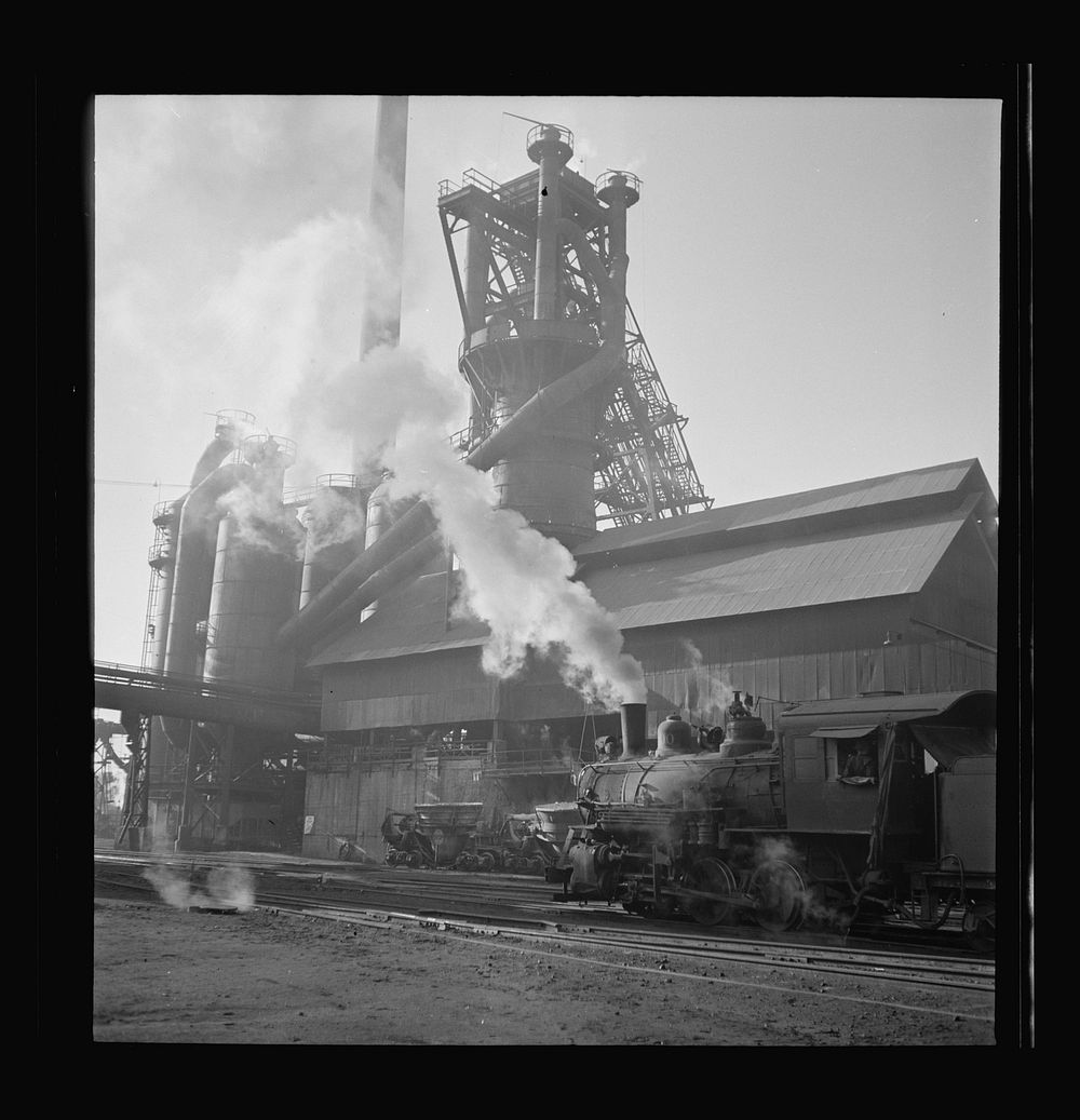 Columbia Steel Company at Ironton, Utah. A locomotive outside the blast furnace. Sourced from the Library of Congress.