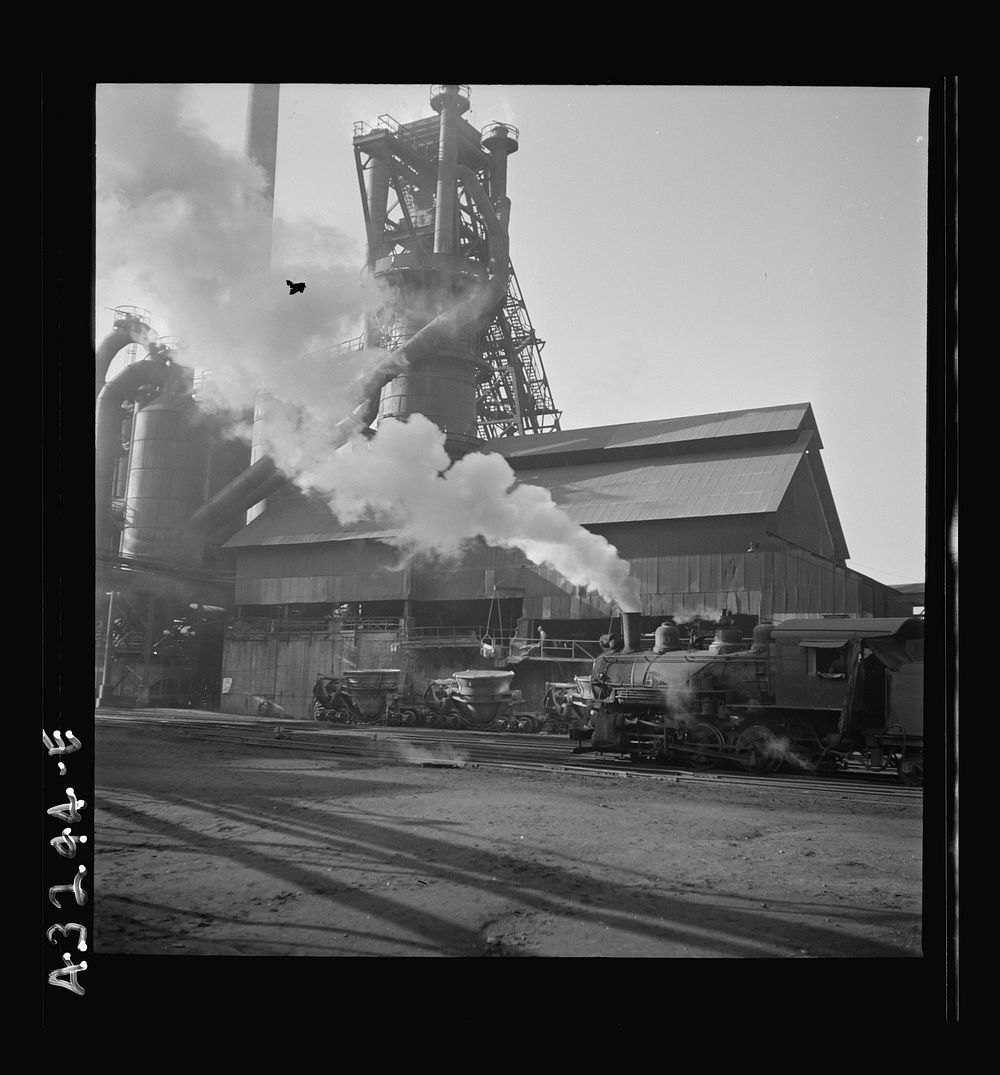 [Untitled photo, possibly related to: Columbia Steel Company at Ironton, Utah. A locomotive outside the blast furnace].…