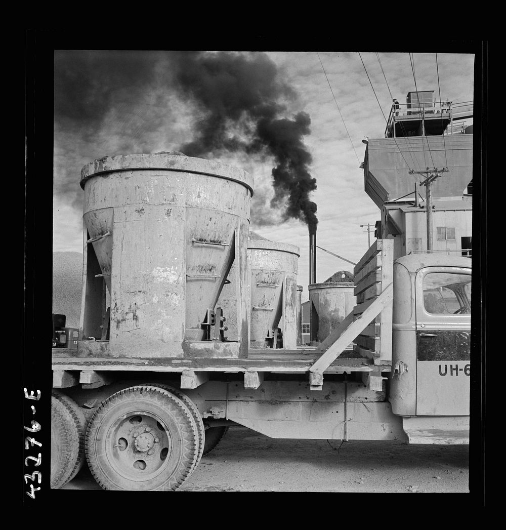 Columbia Steel Company at Geneva, Utah. Truck carrying concrete mixers at a new steel mill which is under construction.…