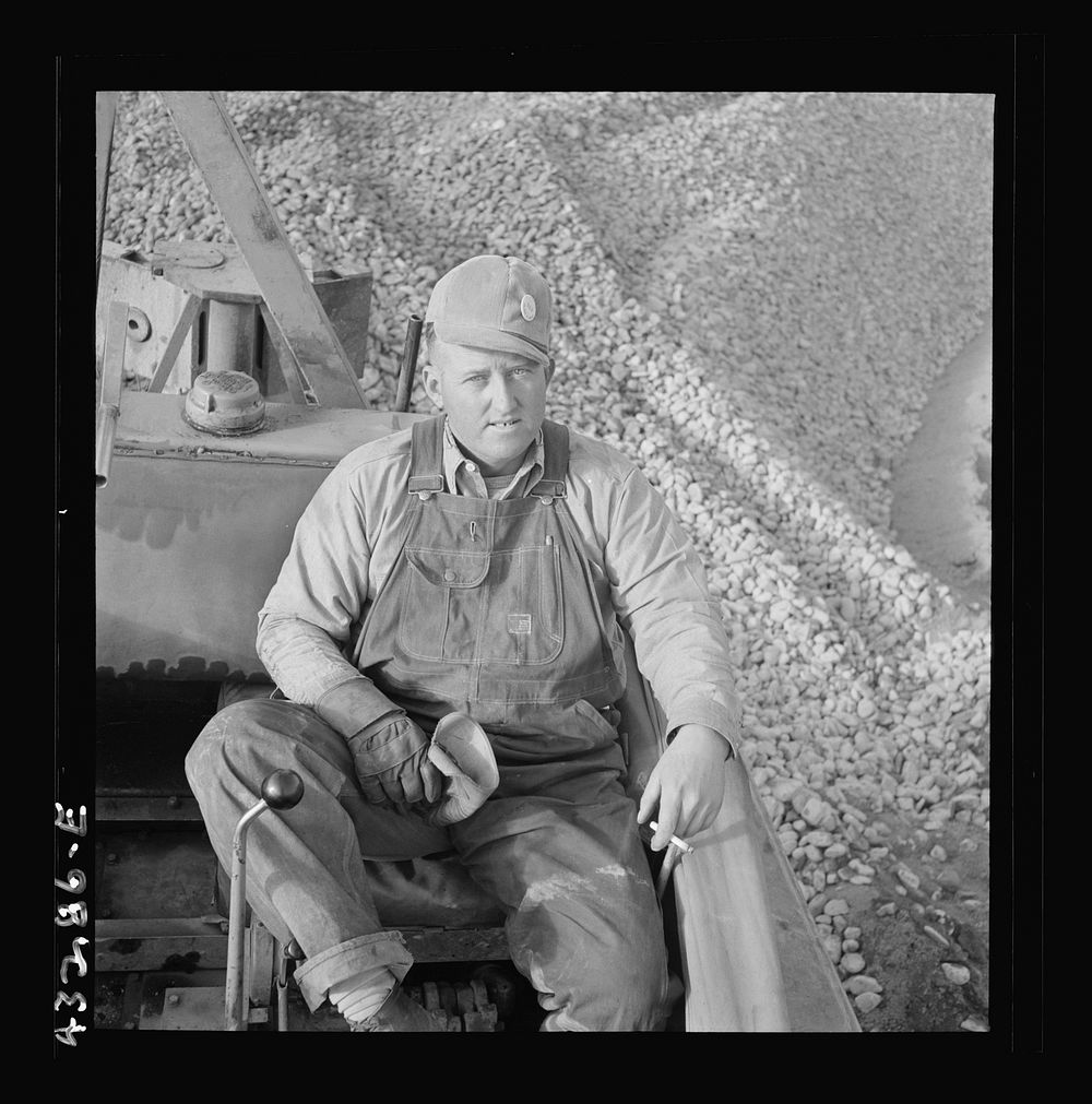 [Untitled photo, possibly related to: Columbia Steel Company at Geneva, Utah. Bulldozer operator who helps in the…