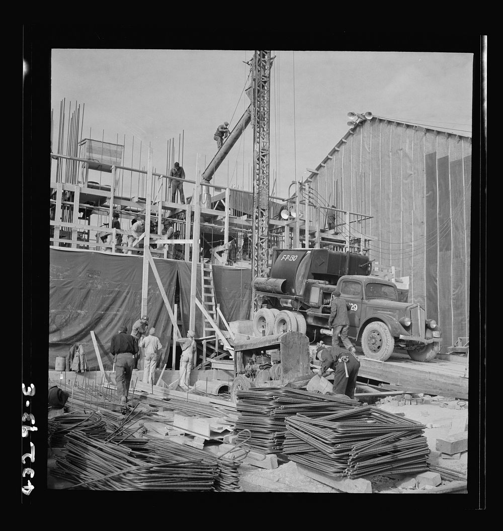 [Untitled photo, possibly related to: Columbia Steel Company at Geneva, Utah. Setting a pipe with a derrick during the…