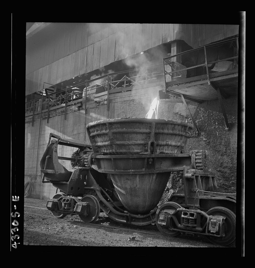 Columbia Steel Company at Ironton, Utah. Tapping a blast furnace for an iron cast. Sourced from the Library of Congress.
