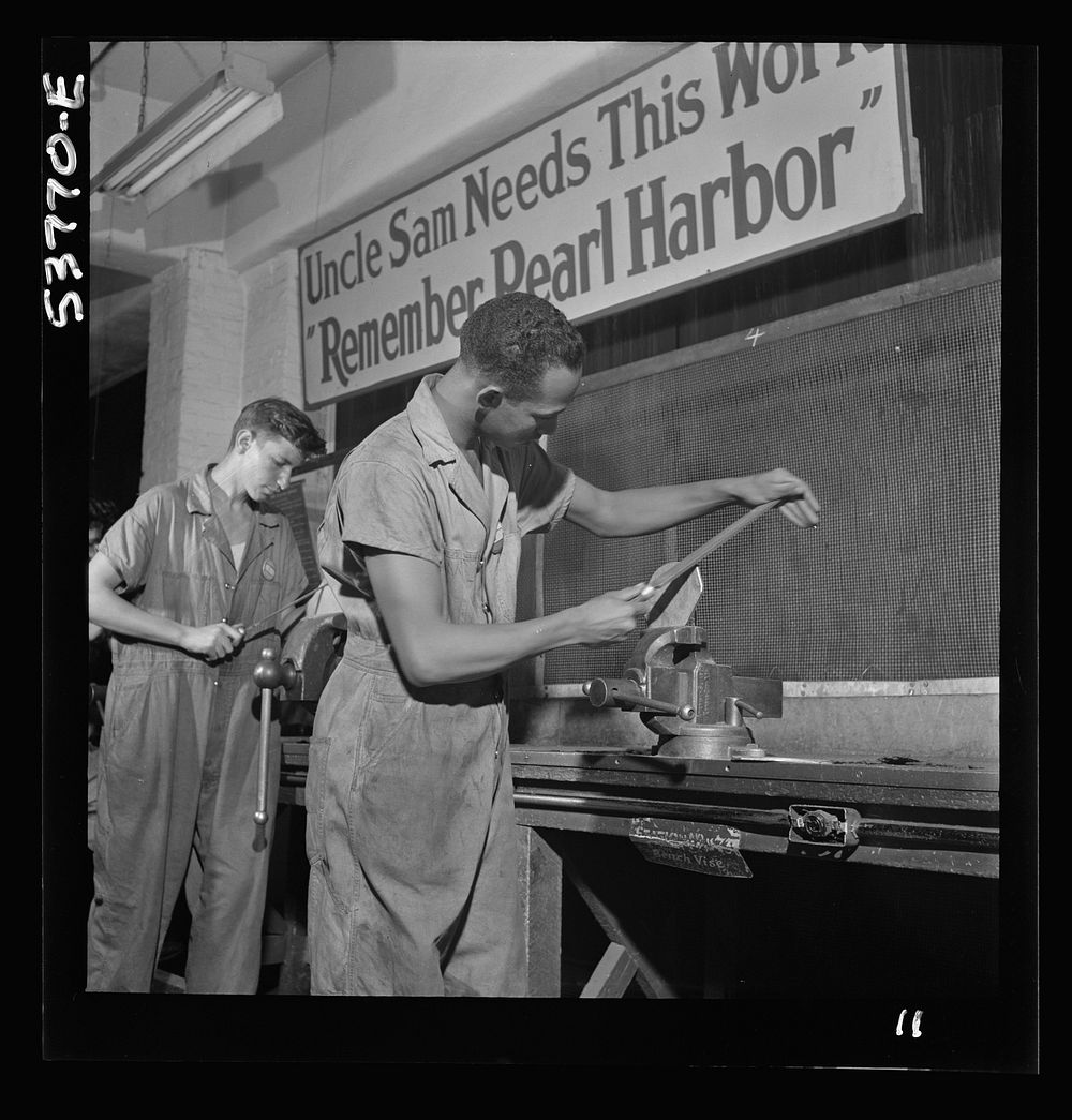 NYA (National Youth Administration) work center, Brooklyn, New York. Two bench workers, who are receiving training in…