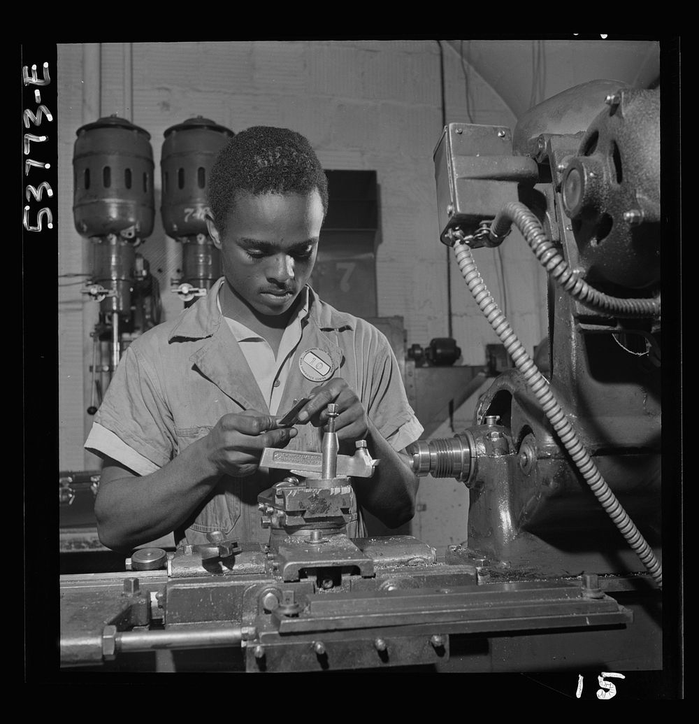 NYA (National Youth Administration) work center, Brooklyn, New York. A  bench-lathe worker, who is receiving training in…