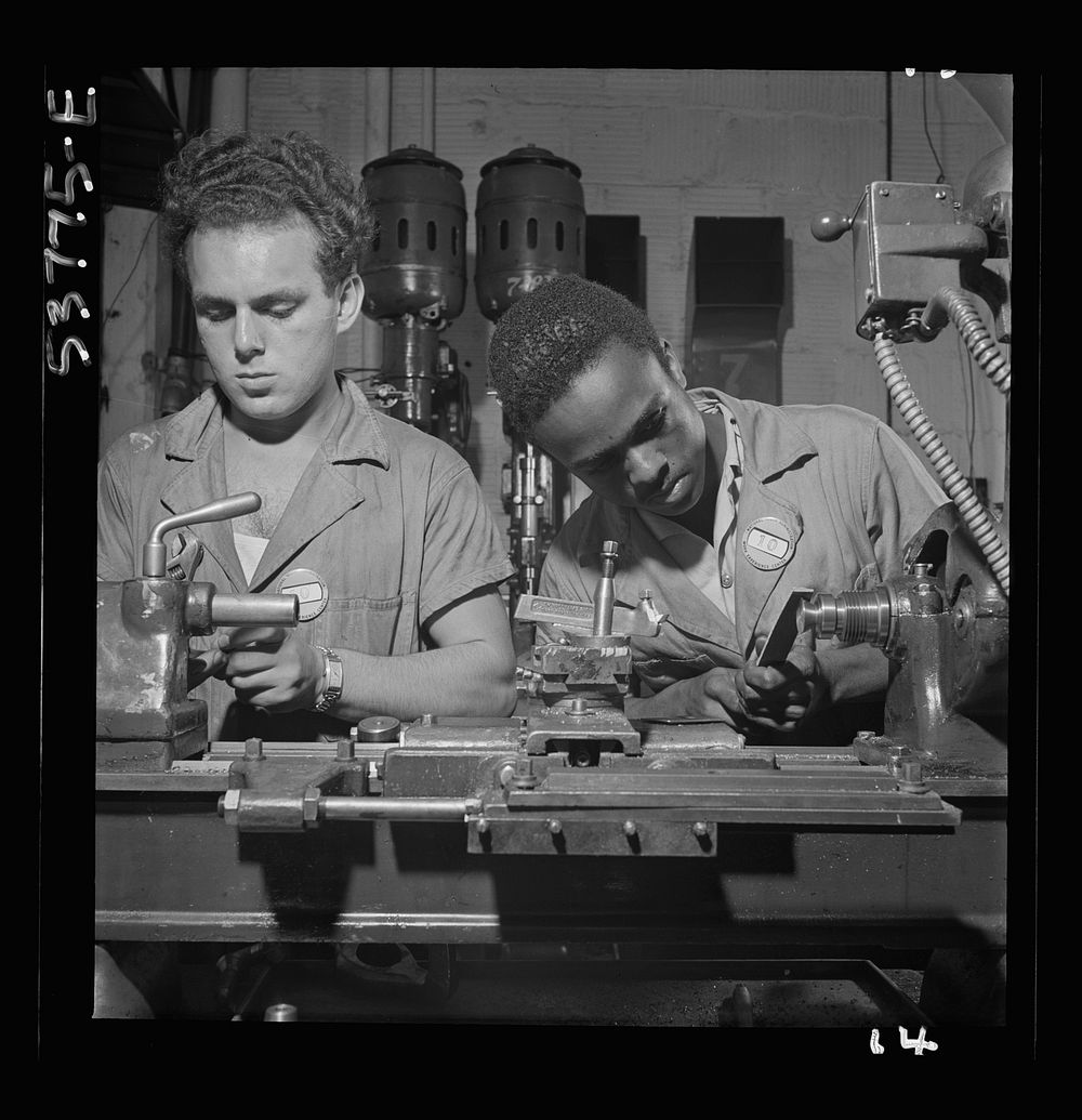NYA (National Youth Administration) work center, Brooklyn, New York. Two bench-lathe workers, who are receiving training in…