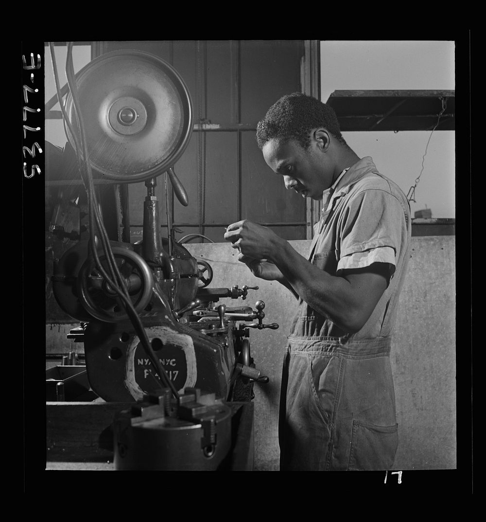 NYA (National Youth Administration) work center, Brooklyn, New York. A  turret-lathe worker, who is receiving training in…