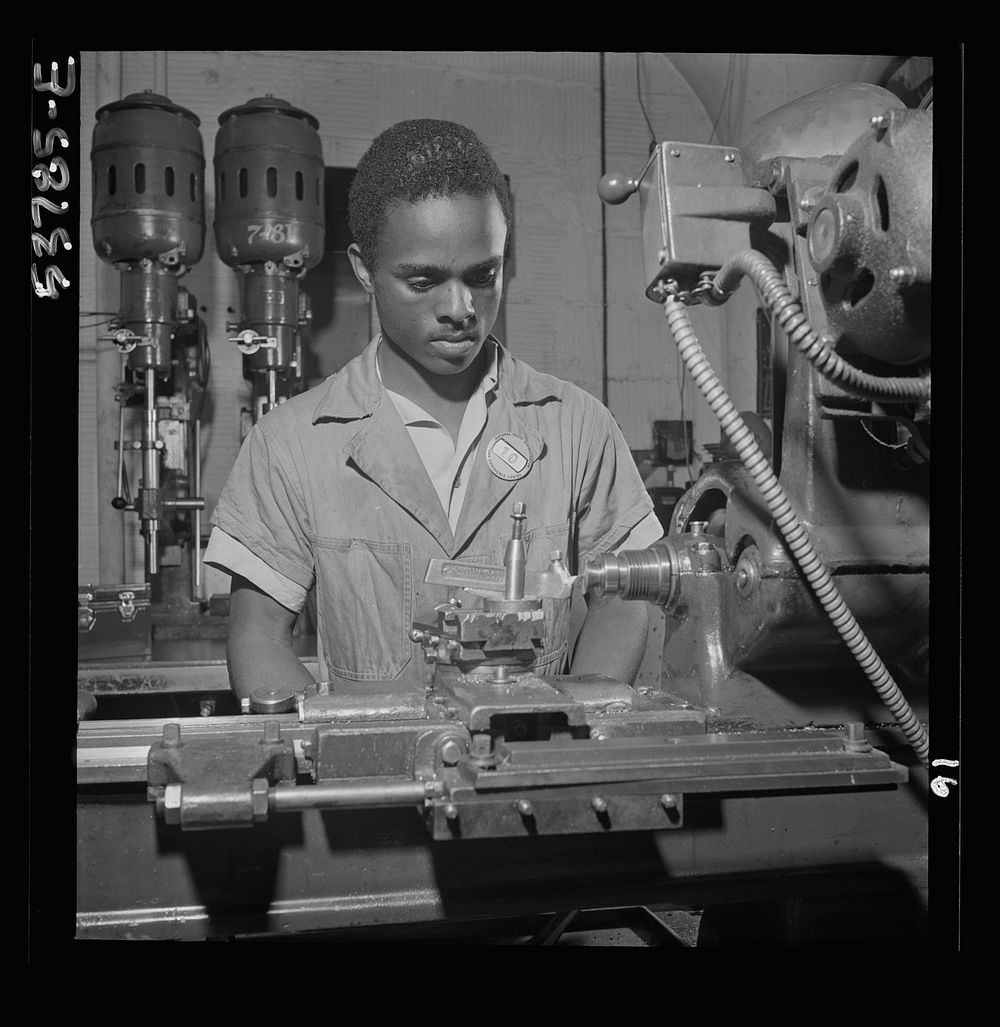 NYA (National Youth Administration) work center, Brooklyn, New York. A  bench-lathe worker, who is receiving training in…