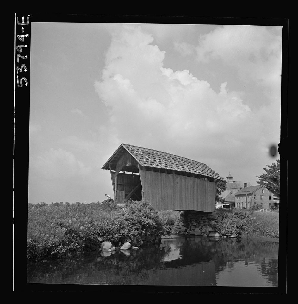 [The Orton home and barn, Marshfield, Vermont as seen from across the Winooski River, showing a covered bridge in the…