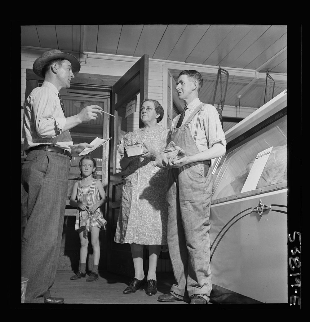 West Danville, Vermont. OPA (Office of Price Administration) inspector Maurice J. Sullivan stopping in for a friendly visit…