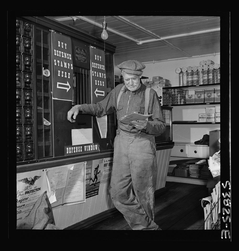 West Danville, Vermont. A farmer reading his mail at the post office in G. S. Hastings's general store. Sourced from the…