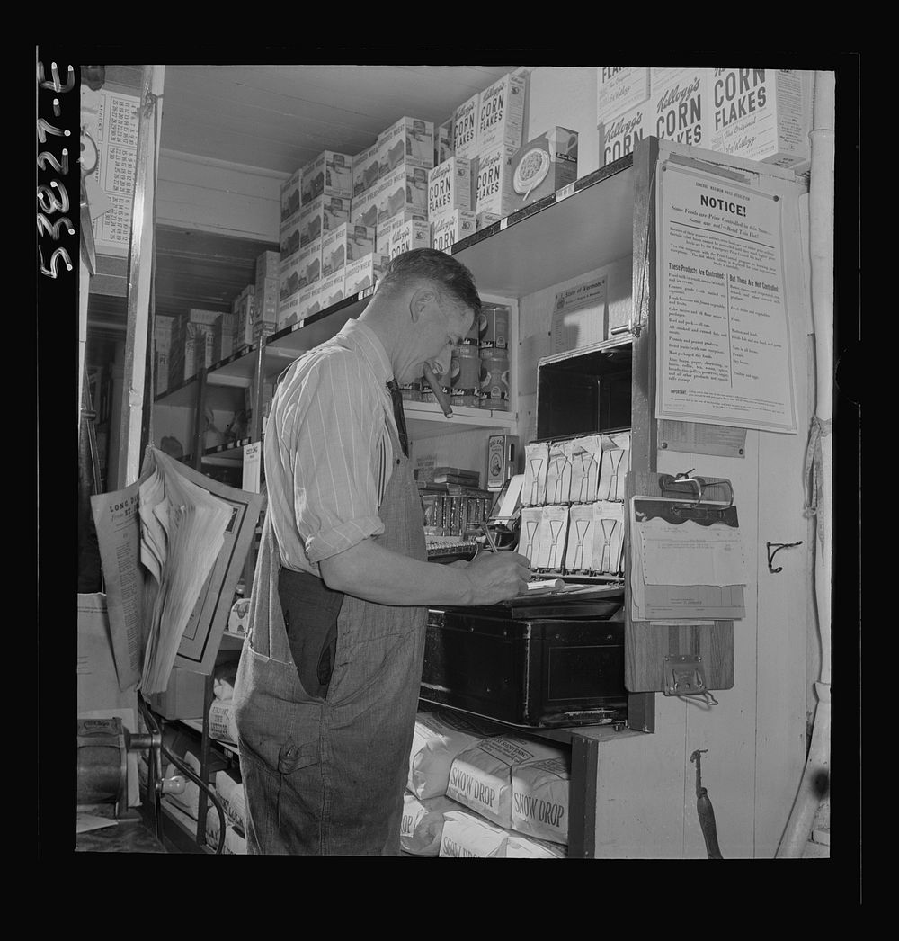 West Danville, Vermont. Mr. Hasings in his general store, figuring up, says, "You can't carry on a business, especially…