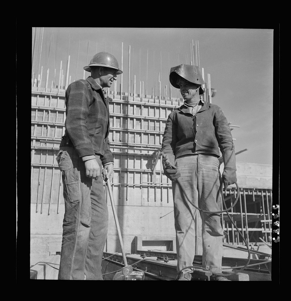 Las Vegas, Nevada. A rigger and a welder at the Basic Magnesium plant in the southern Nevada desert pausing for a moment in…