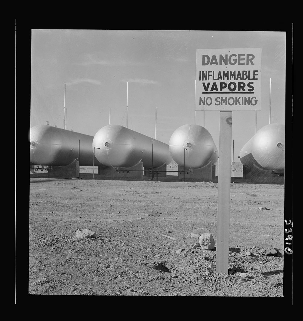 [Untitled photo, possibly related to: Las Vegas, Nevada. Like a row of dirigible balloons, the propane gas storage tanks…