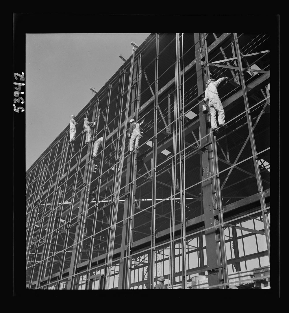 [Untitled photo, possibly related to: Las Vegas, Nevada. Painters at work seventy feet above ground on the gigantic…