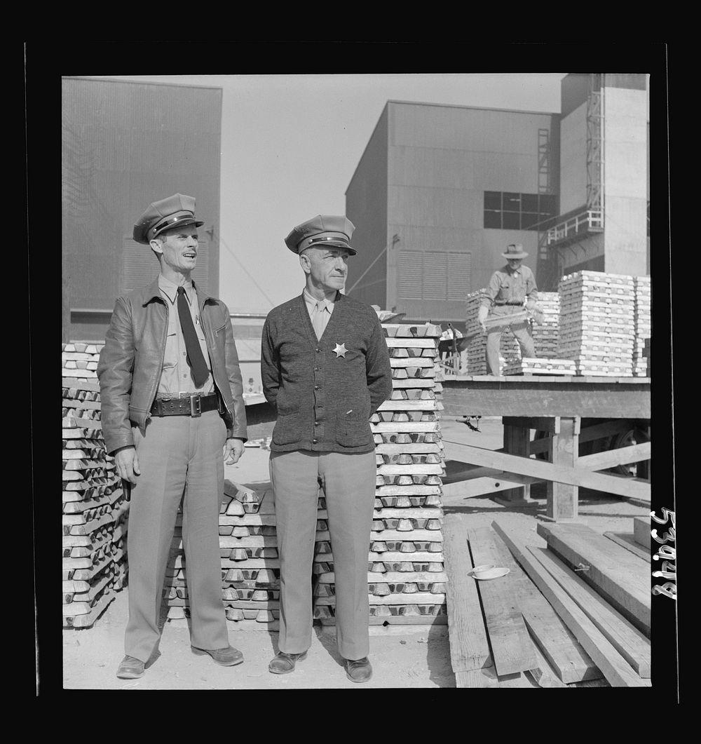 [Untitled photo, possibly related to: Las Vegas, Nevada. Enormous asbestos mittens are worn by the worker handling the hot…