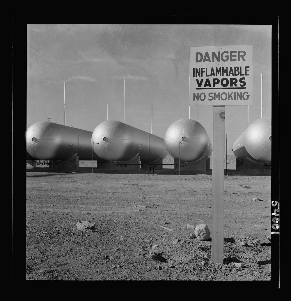 [Untitled photo, possibly related to: Las Vegas, Nevada. Like a row of dirigible balloons, the propane gas storage tanks…