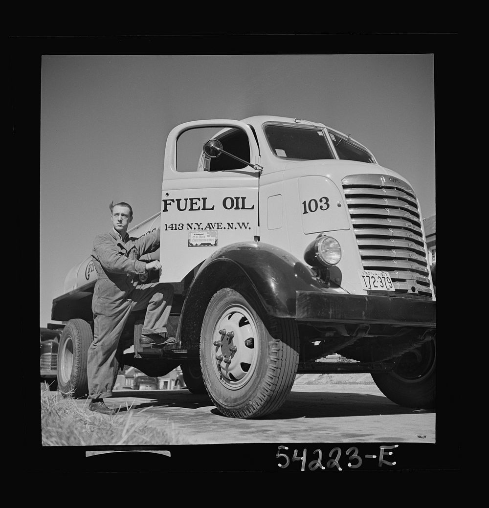 [Untitled photo, possibly related to: Washington, D.C. A Griffith consumers oil tank truck showing the driver opening the…