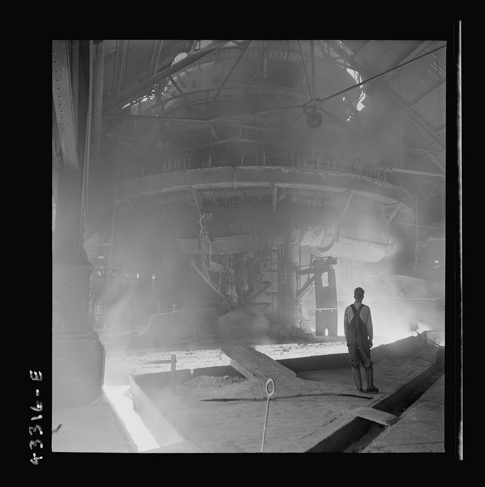 [Untitled photo, possibly related to: Columbia Steel Company at Ironton, Utah. Tapping a heat of iron in the cast house of…