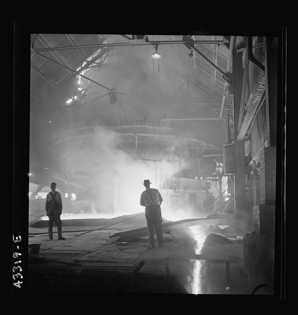 Columbia Steel Company at Ironton, Utah. Tapping a heat of iron in the cast house of the blast furnace. Sourced from the…