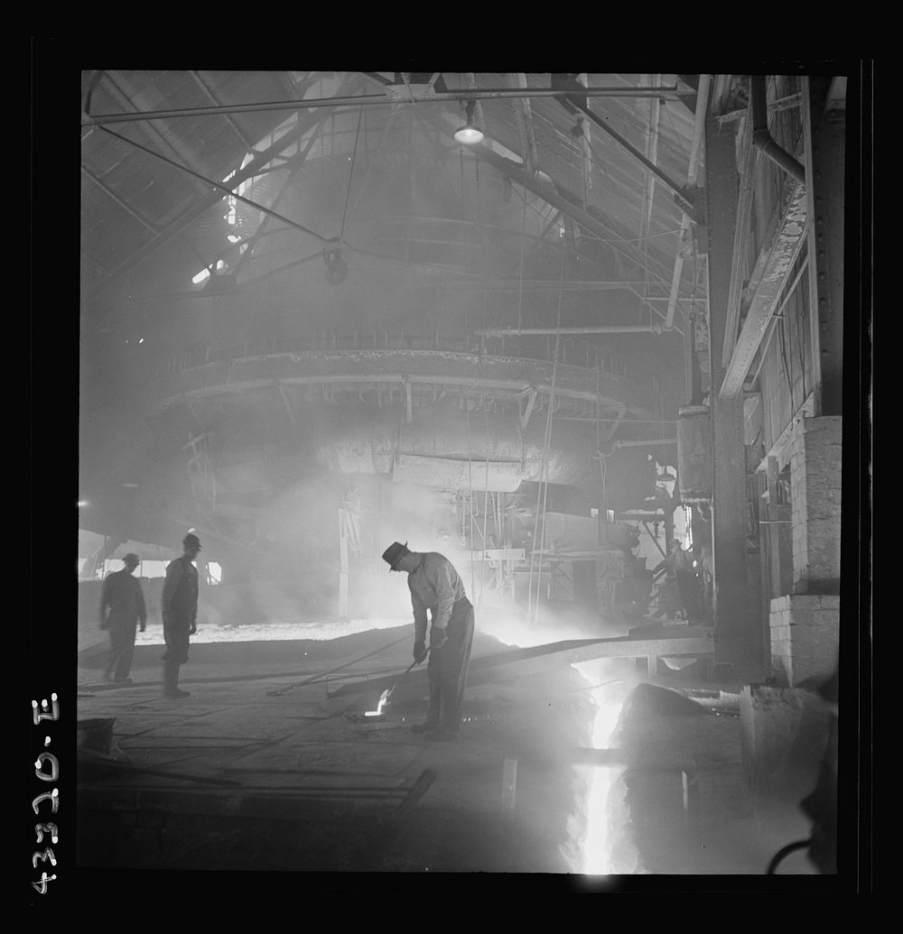 Columbia Steel Company at Ironton, Utah. Tapping a heat of iron in the cast house of the blast furnace. Sourced from the…