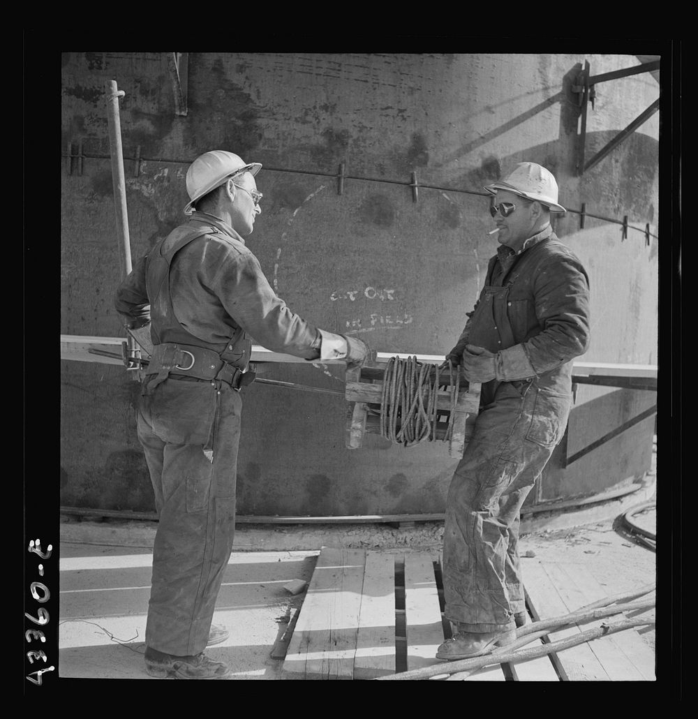 Columbia Steel Company at Geneva, Utah. Two workmen at the new steel mill which is under construction. Sourced from the…